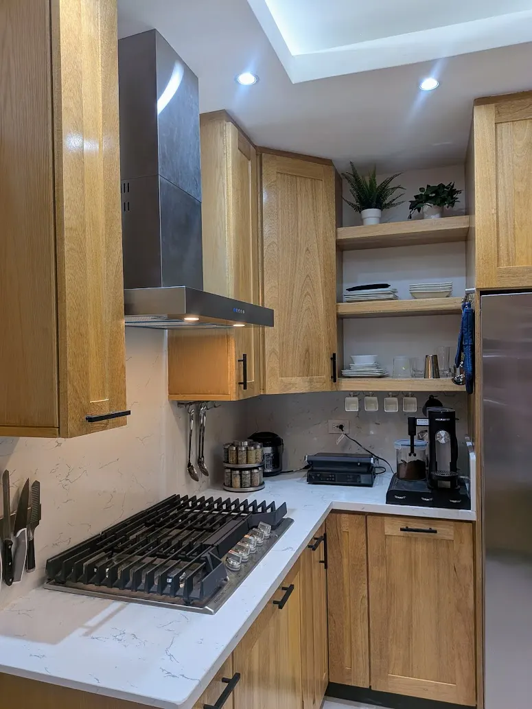 The fully equipped kitchen with quartz countertops