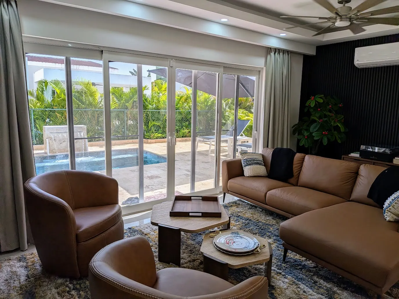 The living room by the sliding glass doors to the pool deck